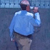 Walking figure with cup