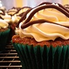 Banana cupcake filled with chocolate ganache, finished with cream cheese frosting and chocolate ganache