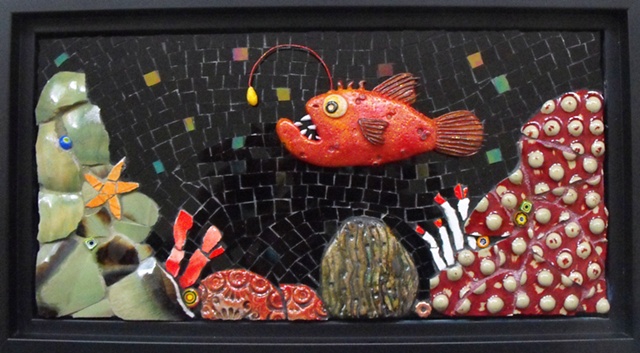 stained glass mosaic of a deep sea anglerfish and coral reef