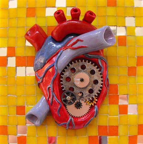 steampunk anatomical heart with gears sculpture made from polymer clay