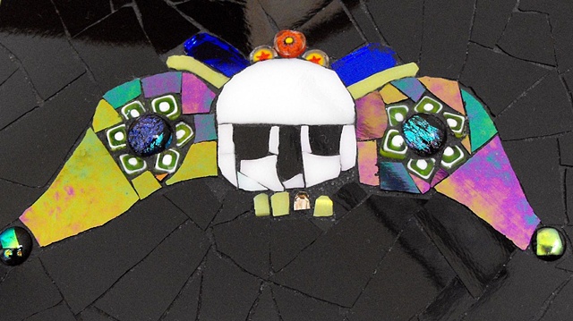 mosaic of Aztec skull with wings