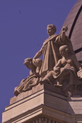 one of the symbols on the top of the manitoba ledgislative building