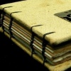 yellow silk book with a tiny tin-type