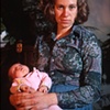 Portrait of my mother, holding me, taken by my father