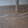 Exhibition Flying Carpet Prayers at El P&oacute;sito, rolled newspaper from Catalunya in the shape of Ca&ntilde;adas Real