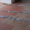 Exhibition Flying Carpet Prayers at El P&oacute;sito, rolled newspaper from Catalunya in the shape of Ca&ntilde;adas Real
