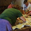 Project Flying Carpet Belalc&aacute;zar, workshop performance, women stitching together the carpet