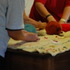 Project Flying Carpet Belalc&aacute;zar, workshop performance, women stitching together the carpet