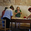 Project Flying Carpet Belalc&aacute;zar, workshop performance, women stitching together the carpet
