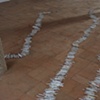 Exhibition Flying Carpet Prayers at El P&oacute;sito, rolled newspaper from Catalunya in the shape of Ca&ntilde;adas Real