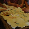 Project Flying Carpet Belalc&aacute;zar, workshop performance, women stitching together the carpet