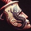 Spirit Head From a Sandy Sea