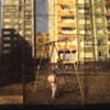 Girl Amidst Apartment Blocks