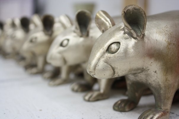 bronze gerbils in a row