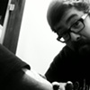 John Snyder Tattooing my arm