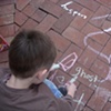 Visitors to The Box, playing with sidewalk chalk and telling ghost stories.