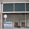 The windows on 100 East Main Street in Spartanburg, SC before the performance