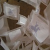 Inhale/Exhale-close-up of suspended screen-printed papers 
