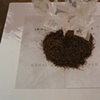 Inhale/Exhale-base with sand blasted mirrors and mound of loose tobacco