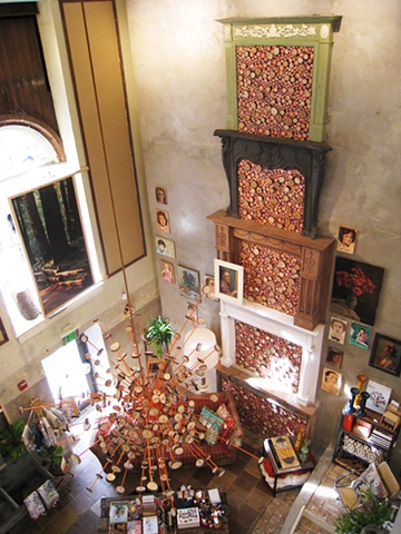 Radiating Disk Chandelier and Log Filled Fireplaces