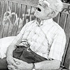 
Dying Man on a Bench in Spain
