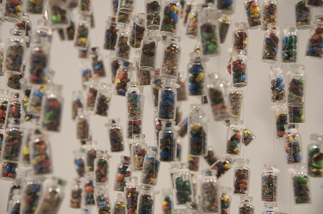 Detail: suspended m&m vials