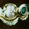 Diamonds
Pearl 
Emerald
Diamond Guard Band
18kt. Gold