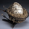 Raku Text Egg in Stove Element with Spanish Moss