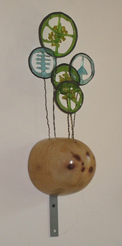 recycled construction lumber, wire, colored glass scraps.
