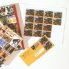 The * Super Deluxe Hardcover Edition with Dustcover* includes a sheet of stamps and a canceled envelope. This edition is limited to 85 envelopes. The stamp being offered is called "Depredation of the Mail", and can be viewed on the following pages.