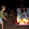 Ellen tossing offering in