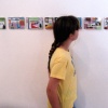 young patron looking at collages.