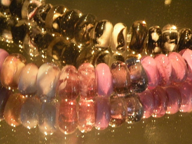 Lampworked beads infused with sand 