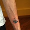 tom's candy heart tattoo