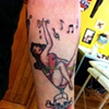 geo's sailor jerry pinup in glass tattoo