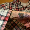pat capoccis flower tattoos on hands