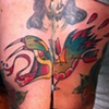 sneakes head tattoo with arrows by sanchez tattooer