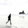 Christina hopping over inlet on Cannon Beach